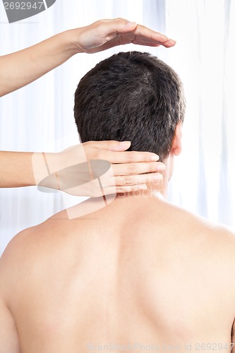 Image of Hand Massaging Man's Head