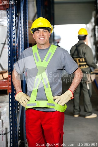 Image of Mid Adult Foreman With Hands On Hips At Warehouse