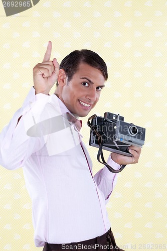 Image of Retro Styled Man Holding Finger in Air