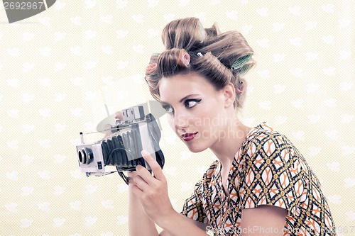 Image of Woman holding Vintage 4x6 Film Camera