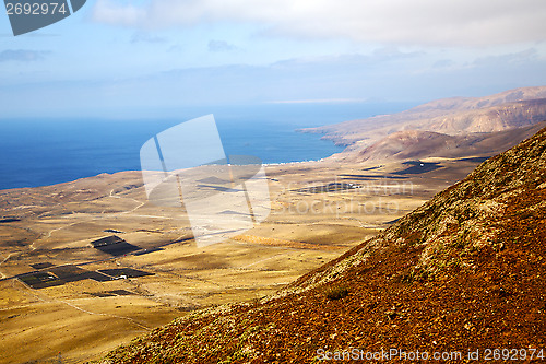 Image of coastline  view from the top africa and house field 