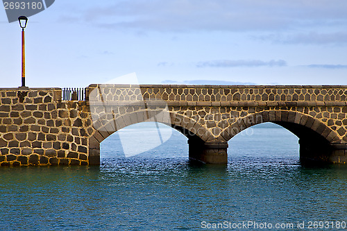 Image of atlantic ocean lanzarote  bridge   in the blue sky    