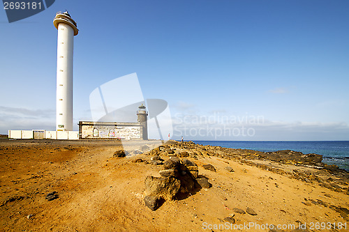 Image of atlantic ocean lanzarote lighthouse and rock  the blue sky    