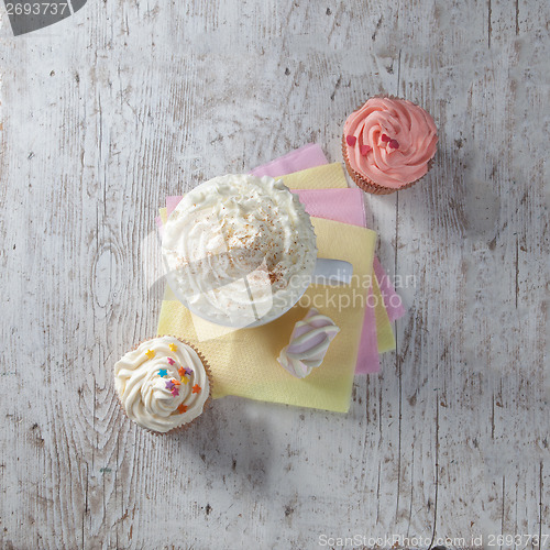 Image of hot chocolate with marshmallows and cream on wooden background