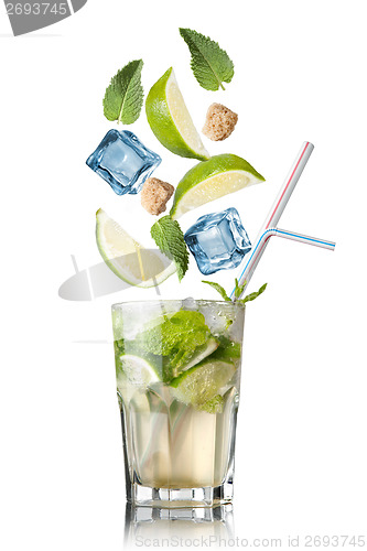 Image of mohito cocktail with falling ingredients isolated on white