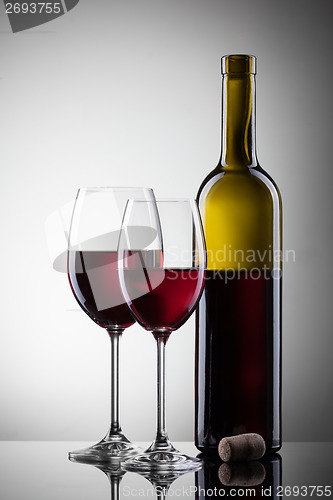 Image of Wine in glasses and bottle on white