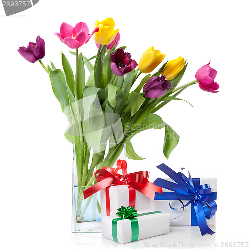 Image of Color tulips and presents isolated on white