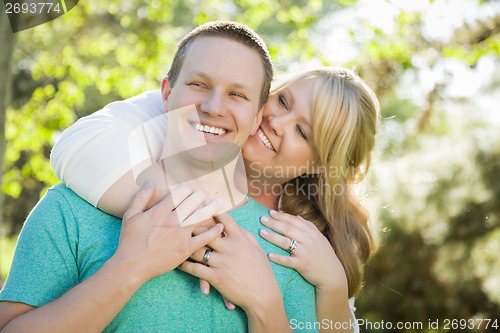 Image of Young Attractive Couple Hugging in the Park