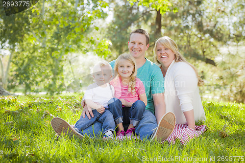 Image of Young Attractive Family Portrait in the Park