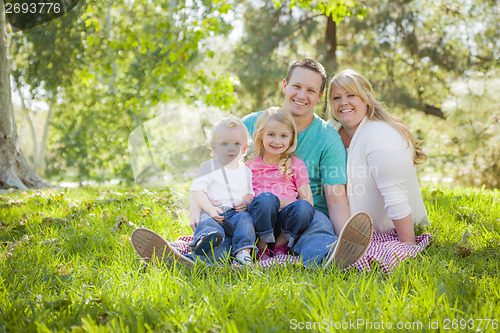 Image of Young Attractive Family Portrait in the Park