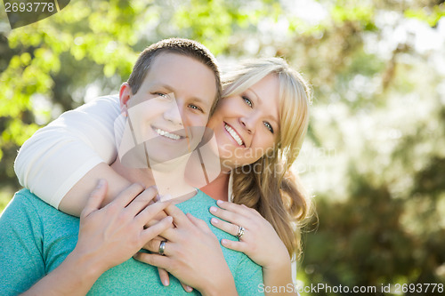 Image of Young Attractive Couple Hugging in the Park