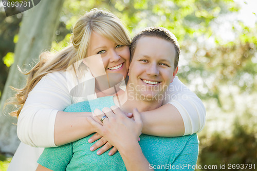 Image of Young Attractive Couple Hugging in the Park