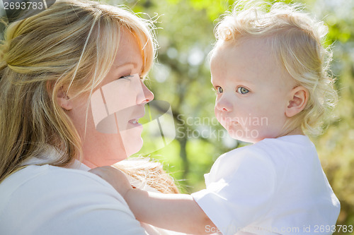 Image of Young Mother Holding Her Adorable Baby Boy