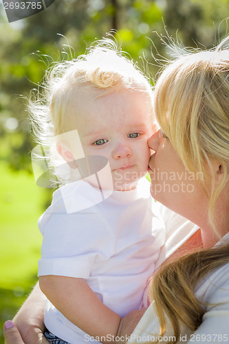 Image of Young Mother Holding Her Adorable Baby Boy