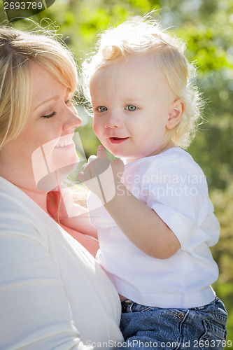 Image of Young Mother Holding Her Adorable Baby Boy