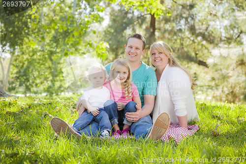 Image of Young Attractive Family Portrait in the Park