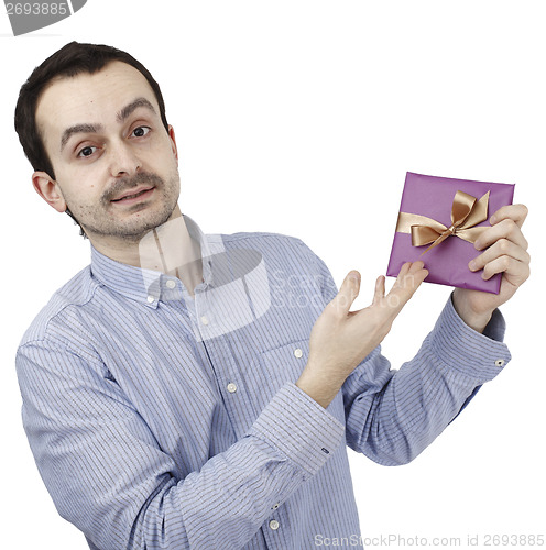 Image of Young man holding a present