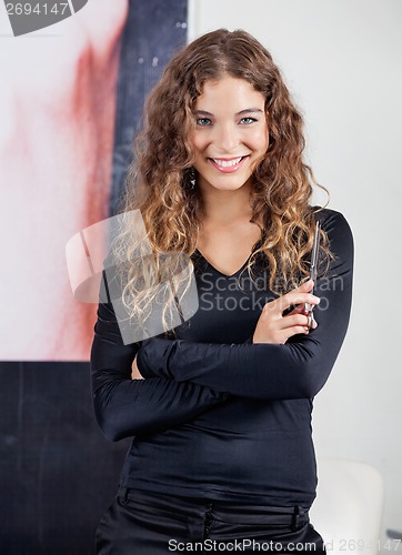 Image of Confident Female Hairdresser With Arms Crossed