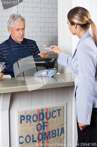 Image of Customer Making Payment By Credit Card