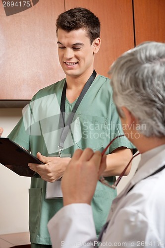 Image of Male Technician Holding Clipboard