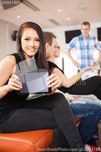 Image of Young Woman Showing Digital Tablet in Bowling Club