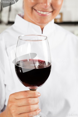 Image of Female Chef Holding Wine Glass