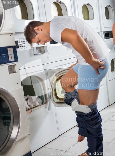 Image of Man In Front Washing Machine