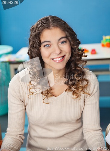 Image of Beautiful Teacher With Smiling In Kindergarten