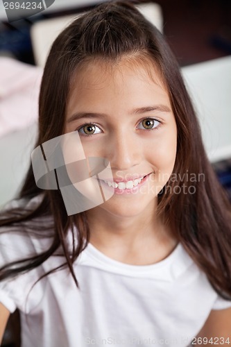 Image of Closeup Of Schoolgirl Smiling In Classroom
