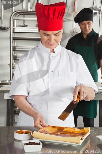 Image of Chef Preparing Chocolate Roll