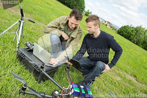 Image of Engineers Repairing UAV Helicopter