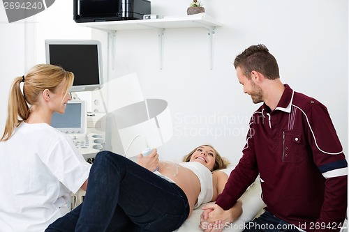 Image of Pregnant Woman Looking At Man