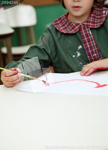 Image of Little Boy Painting In Art Class