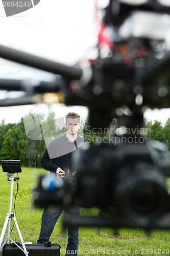 Image of UAV Flying With Focus On Technician