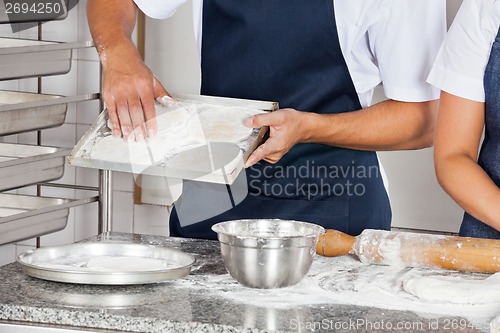 Image of Chefs Working In Restaurant Kitchen