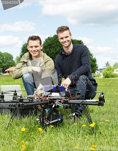 Image of Engineers With Laptop And Digital Tablet By UAV