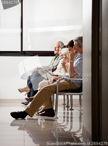 Image of People Sitting In Waiting Area