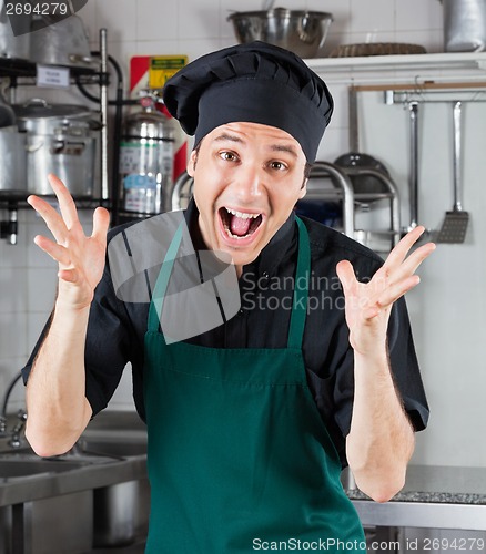 Image of Male Chef Shouting In Restaurant Kitchen
