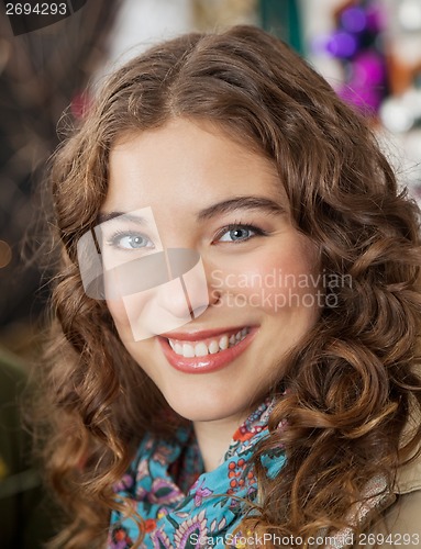 Image of Beautiful Woman Smiling In Christmas Store