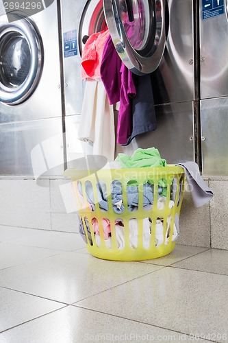 Image of Overloaded Washing Machine And Laundry Basket