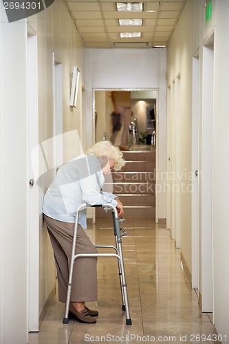 Image of Elderly Woman Standing In Passageway