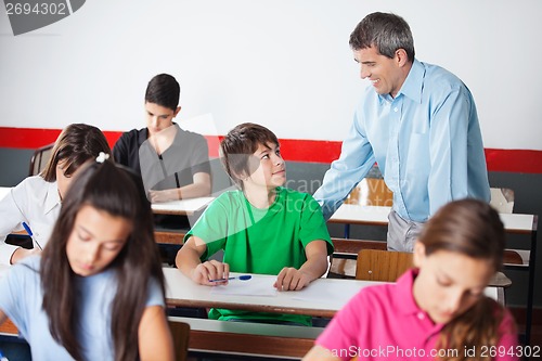 Image of Male University Student And Professor Looking At Each Other