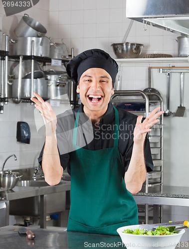 Image of Male Chef Gesturing In Kitchen