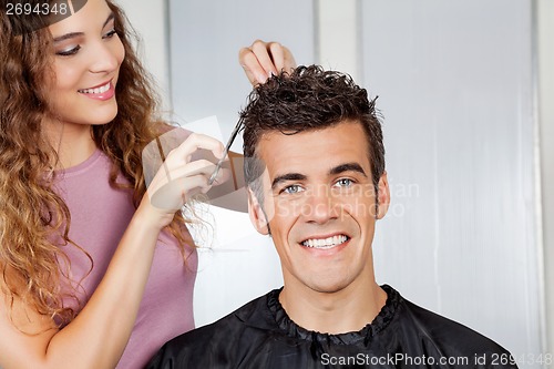 Image of Client Getting Haircut From Hairdresser