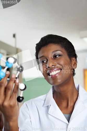 Image of Female Teacher Analyzing At Molecular Structure