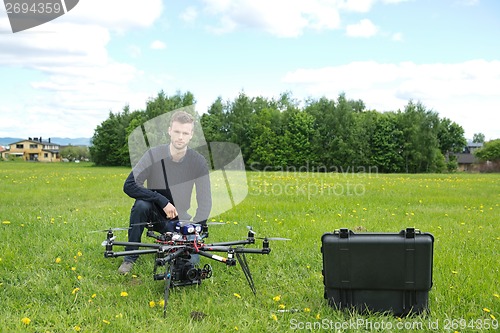 Image of Engineer With UAV Helicopter in Park