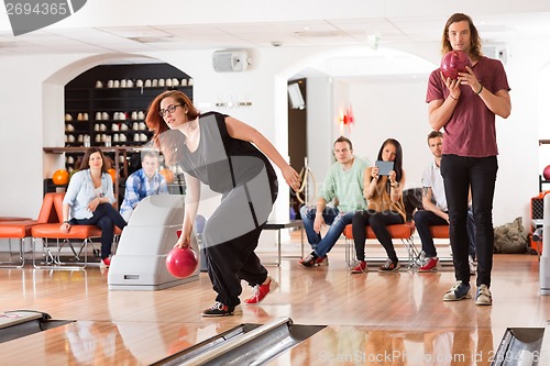 Image of Friends Bowling in Club