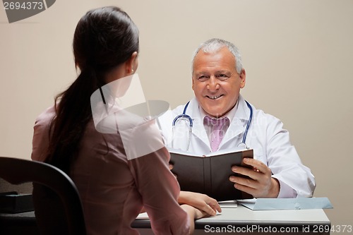 Image of Doctor Looking At Patient