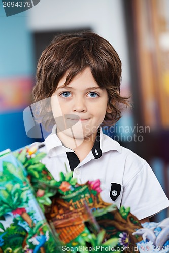 Image of Little Boy With Craft In Kindergarten
