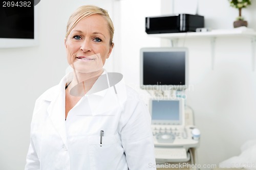 Image of Female Radiologist Standing In Examination Room